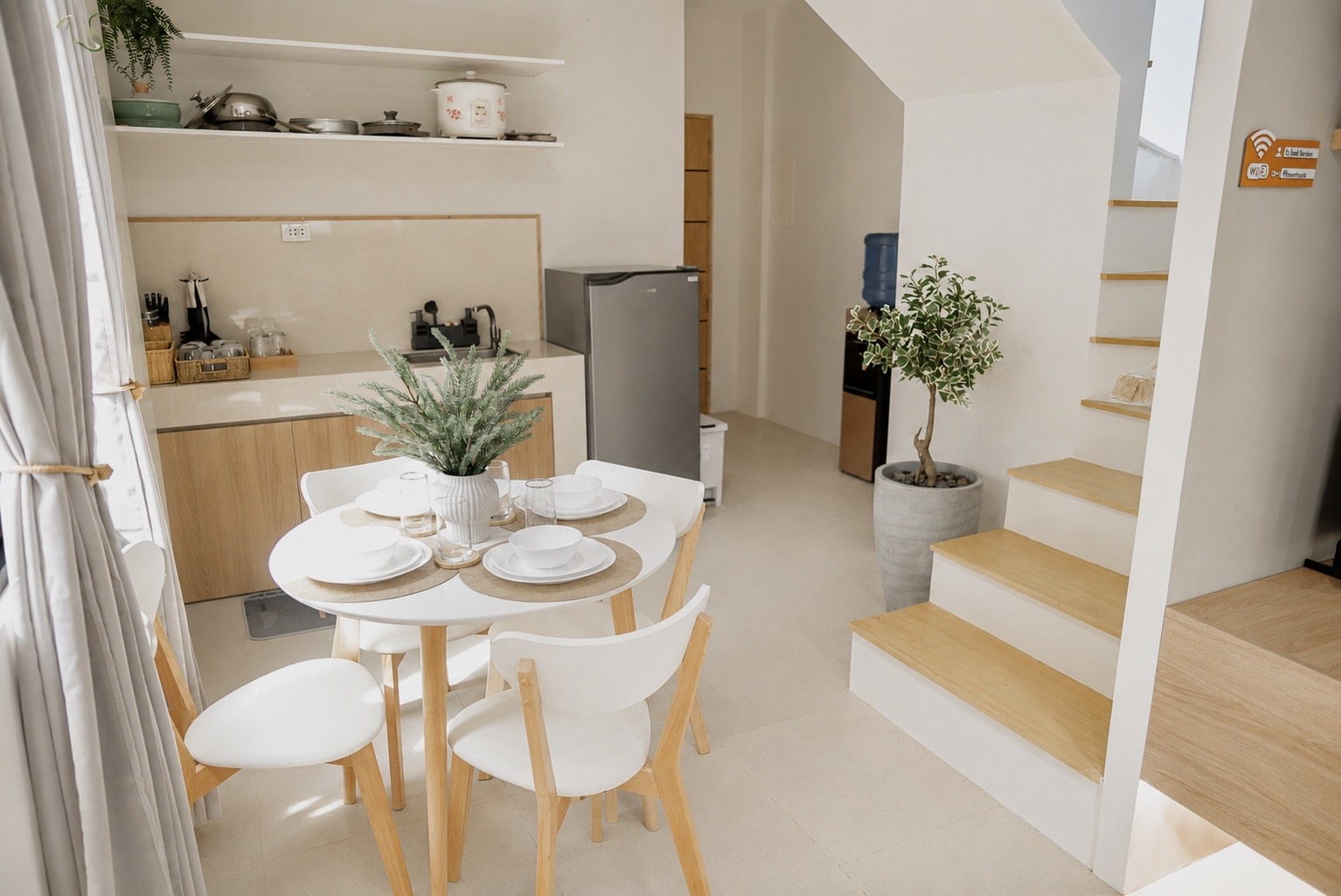 Dining area and kitchenette with natural wood finishes