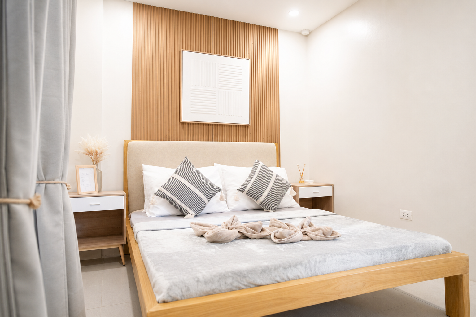 Bedroom with soft linens and warm timber bed frame